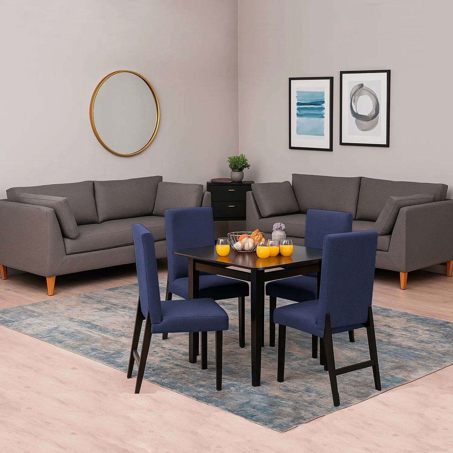 Dos sofás en tela gris con patas en madera color natural, ubicado en sala moderna, ambientado con comedor de madera en tono negro y sillas tapizadas color azul. Ideal para hogares colombianos que buscan confort y estilo moderno - All Star muebles