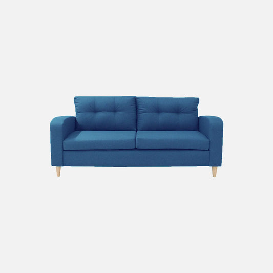 Sofá Brisa visto de frente en tela color azul con patas de madera clara y diseño moderno con tapizado capitoné, ideal para salas modernas - All Star Muebles Colombia