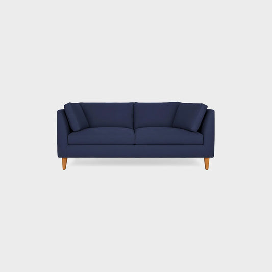Sofá Gales dos puestos visto de frente, tapizado color azul, con patas en madera torneada tono natural, fotografía sobre fondo blanco, ideal para visualizar la combinación de estilos y colores - All Star muebles